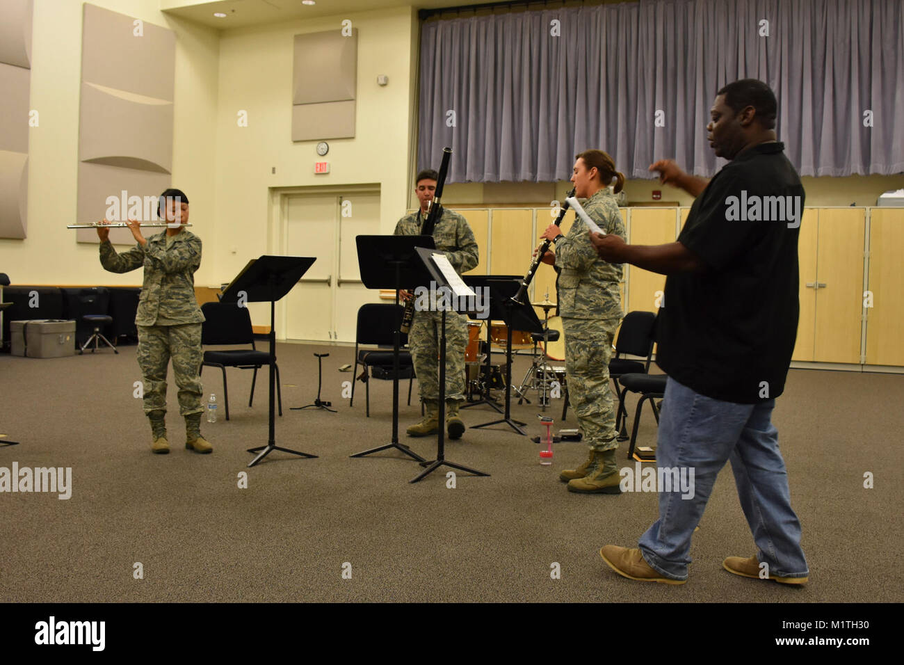 Members of the U.S. Air Force Band of the Golden West play a trio for ...