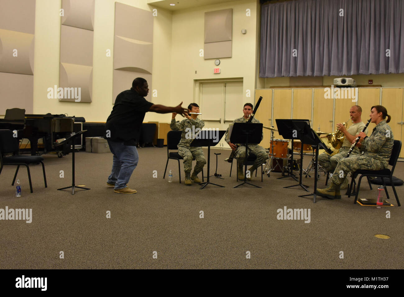 Members of the U.S. Air Force Band of the Golden West play a woodwind ...