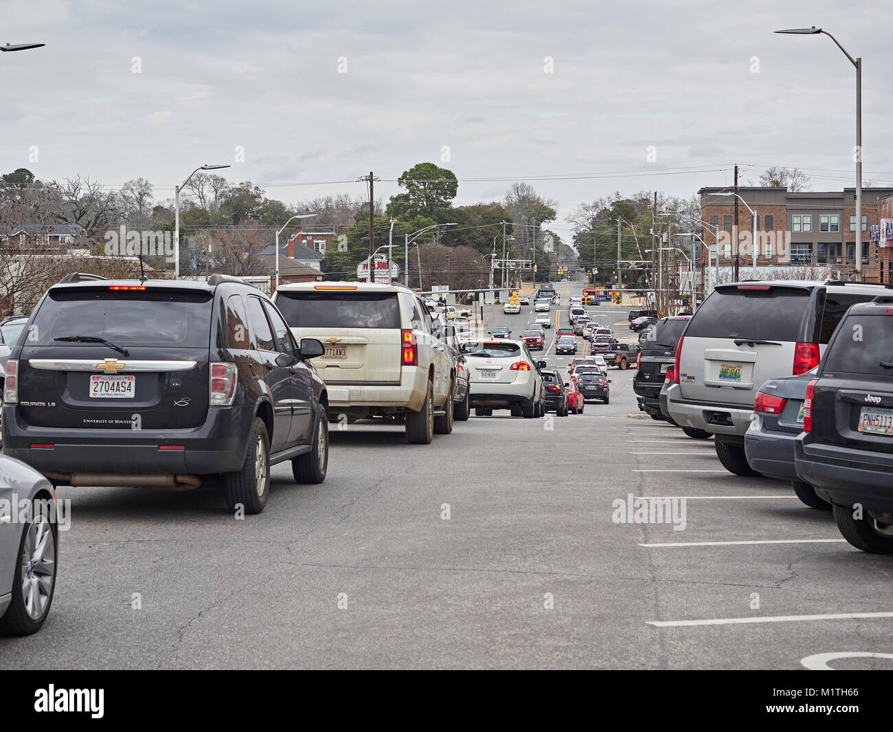 Vehicle traffic on College Street backed up in gridlock in the small town of Auburn Alabama, United States. Stock Photo