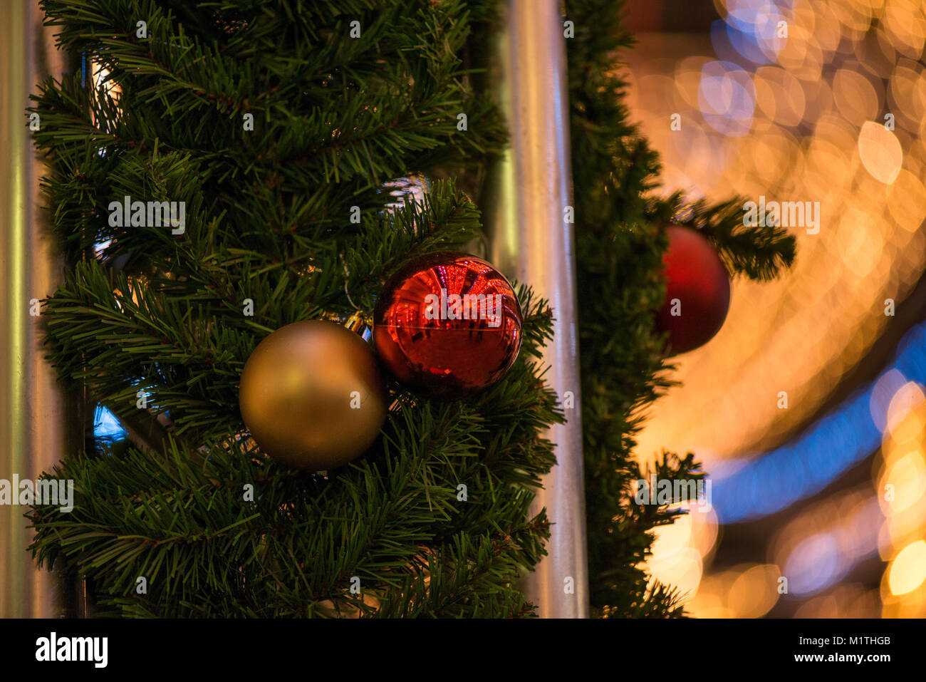 Decorated Christmas tree with hanging golden and red glass balls on ...