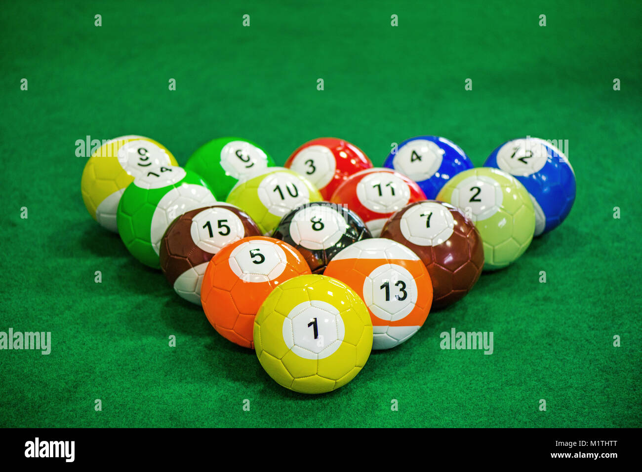 Shot of foot pool balls standing on green table. Foot Pool is the hybrid combination of pool and