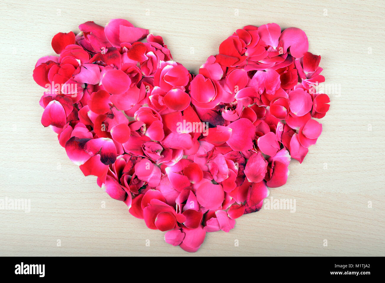 Heart shape rose petals arrangement for Valentines Day Stock Photo Alamy