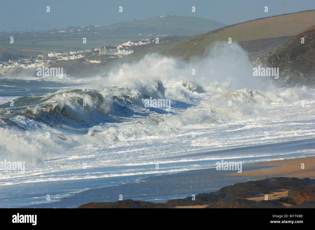 Crashing waves hitting a beach near Porthleven on the Lizard Peninsula, Cornwall, UK - John Gollop Stock Photo