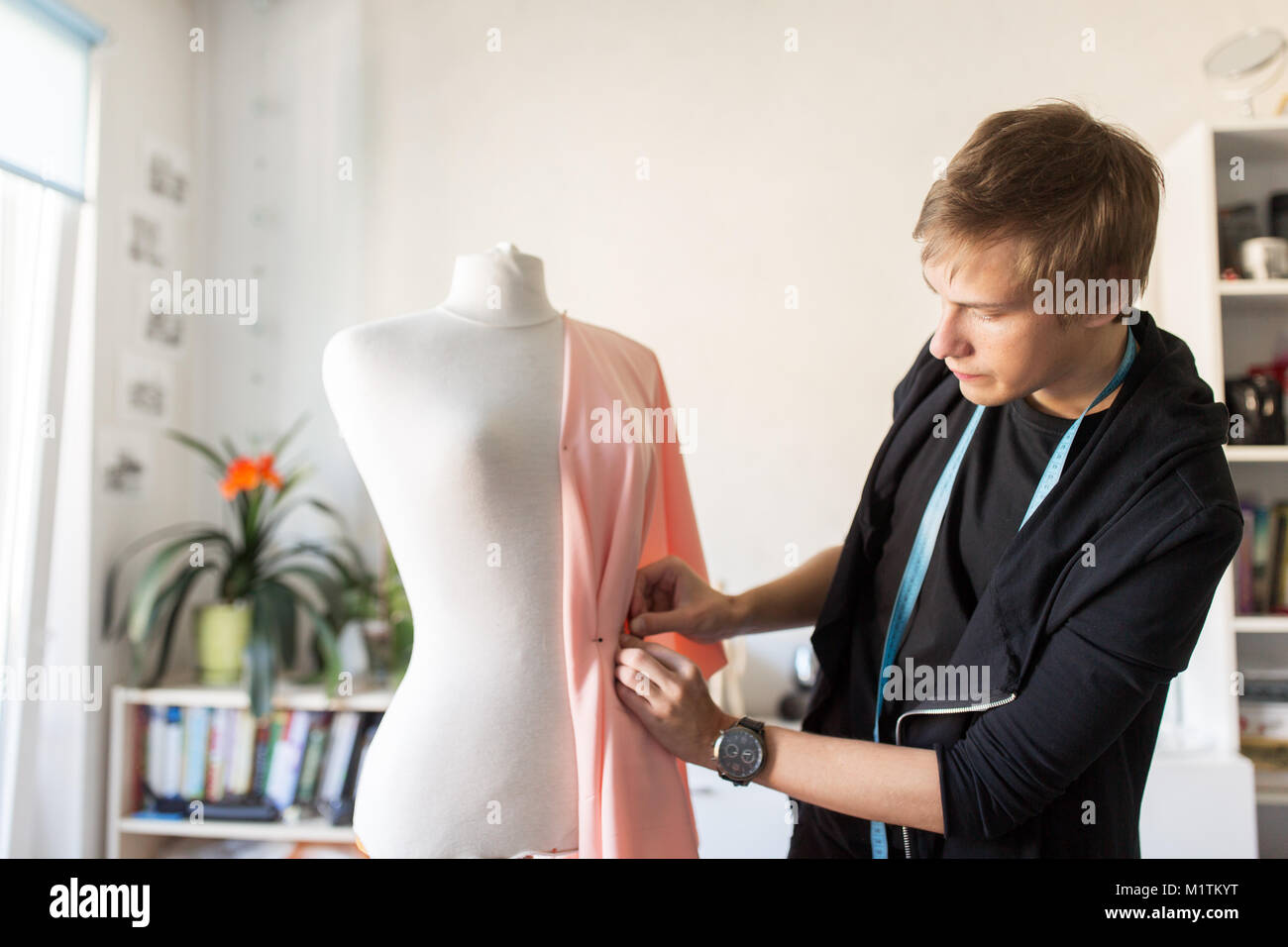 fashion designer with dummy making dress at studio Stock Photo Alamy