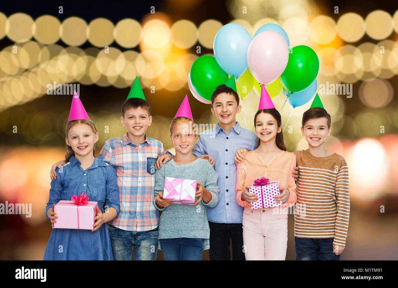 happy children with gifts at birthday party Stock Photo - Alamy