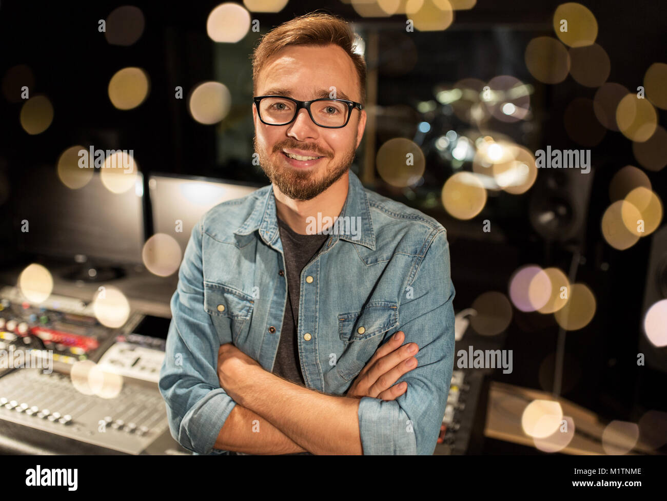 man at mixing console in music recording studio Stock Photo - Alamy