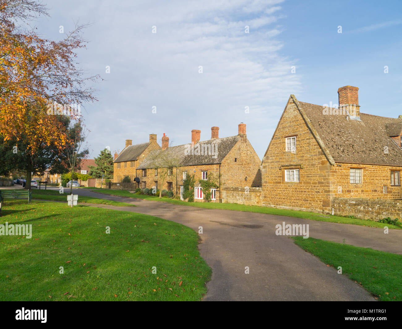 Mellow stone houses gathered around the green in the pretty village of