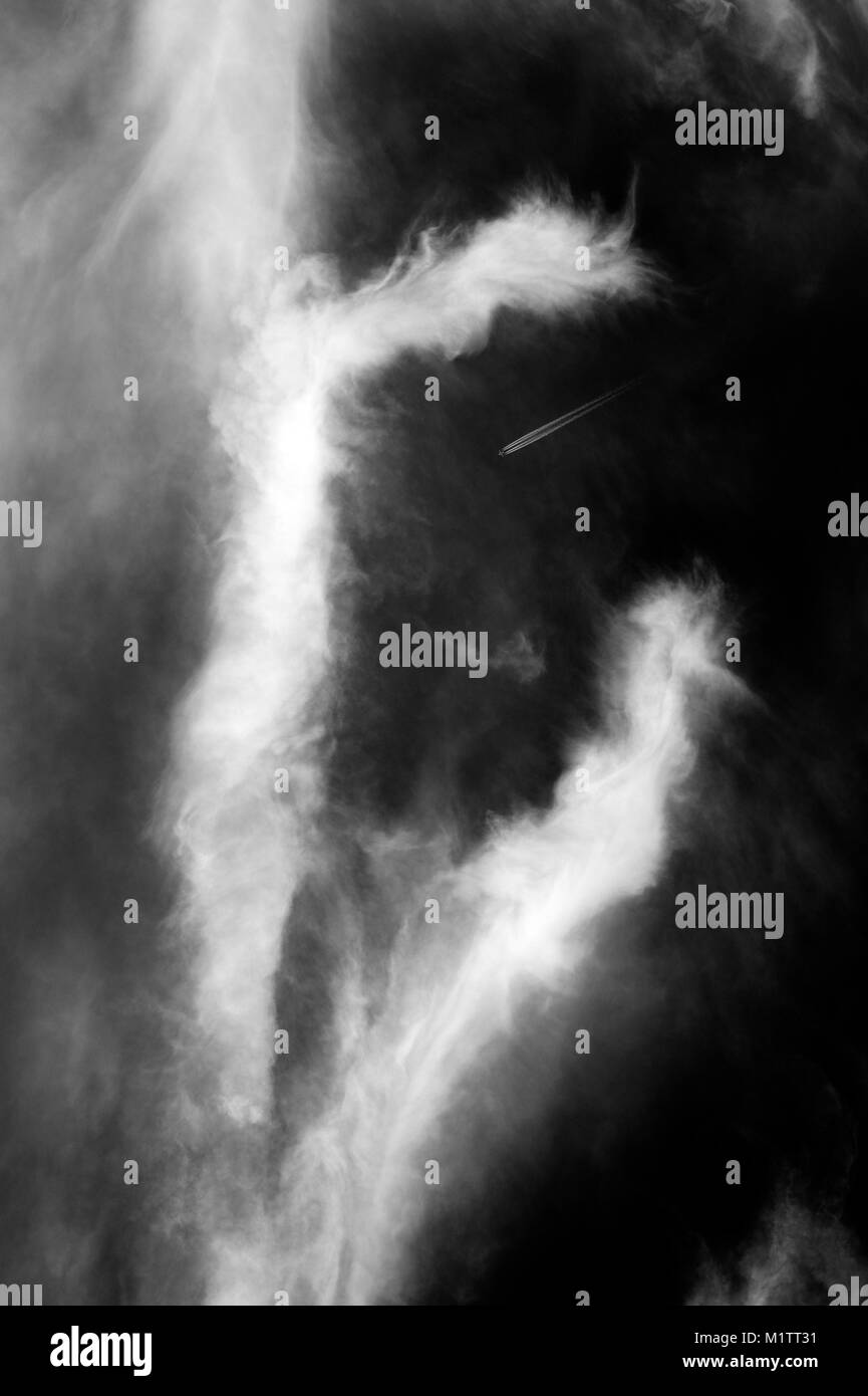 Cirrus clouds wisps of light clouds with natural patterns in black and white. Stock Photo