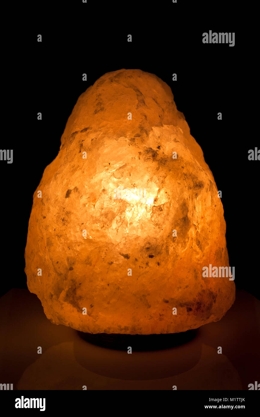 Soothing warm glow from Himalayan salt lamp. Stock Photo