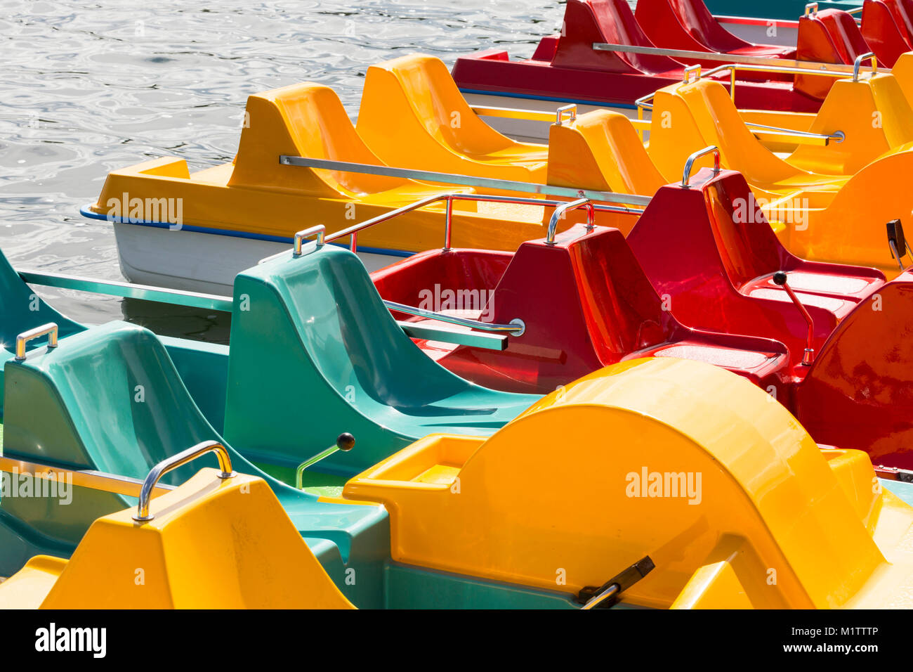 Colored pedalos on a lake are waiting for tourists Stock Photo Alamy