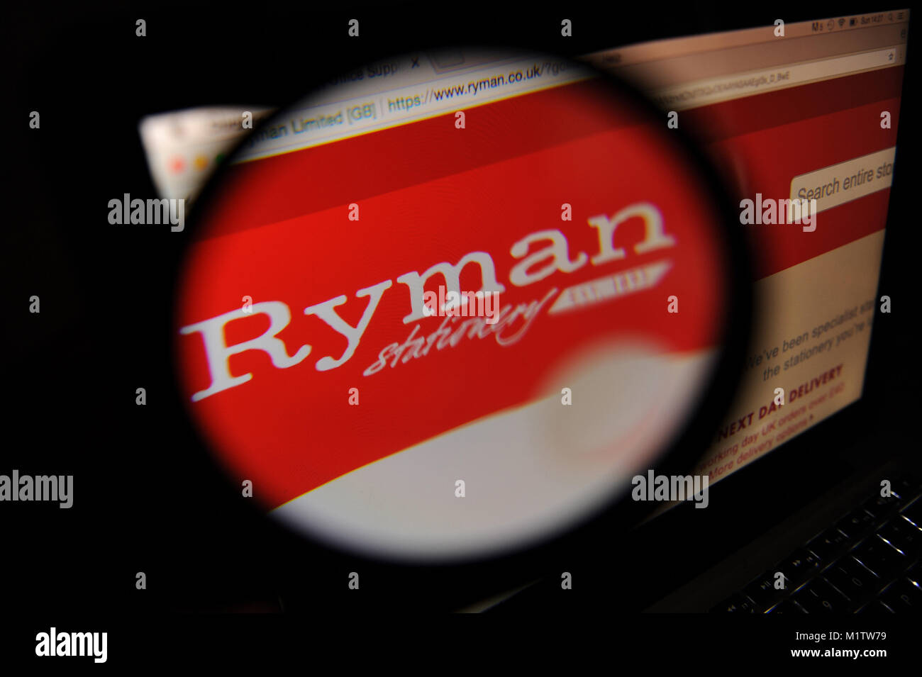 The Ryman website seen through a magnifiying glass Stock Photo