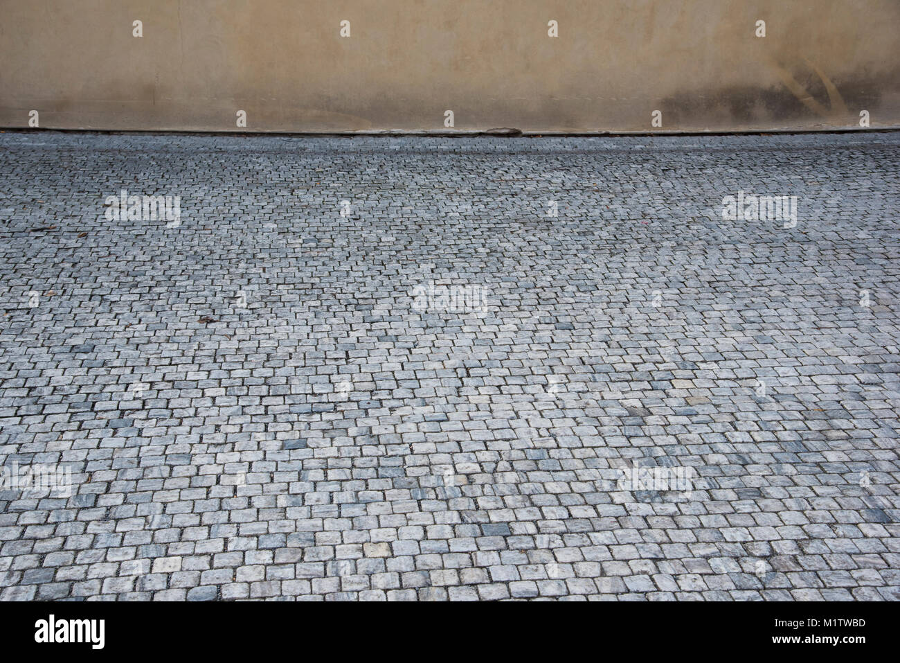 Gray cobble stones background outdoors in the street Stock Photo