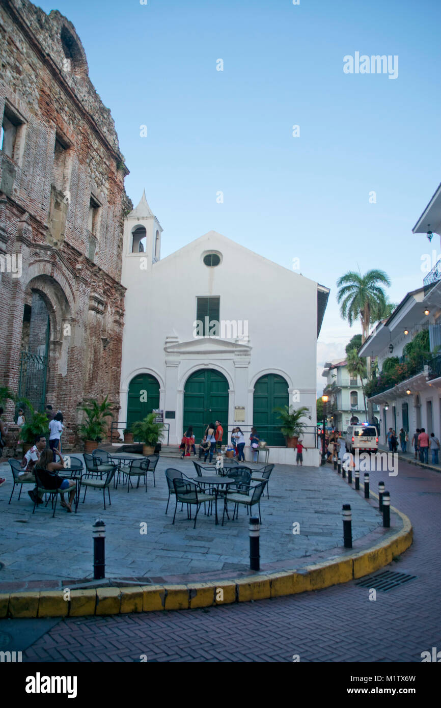 People sitting in by Santo Domingo convent on a street in Casco Viejo, Panama City, Panama. Stock Photo