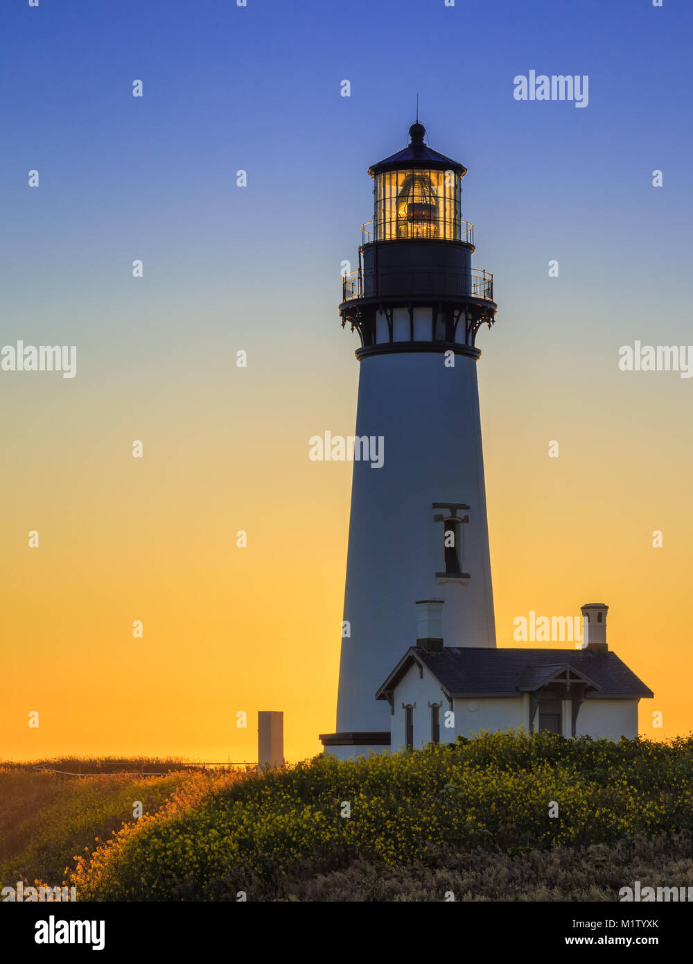 Yaquina Head Lighthouse at Sunset, Oregon, USA Stock Photo