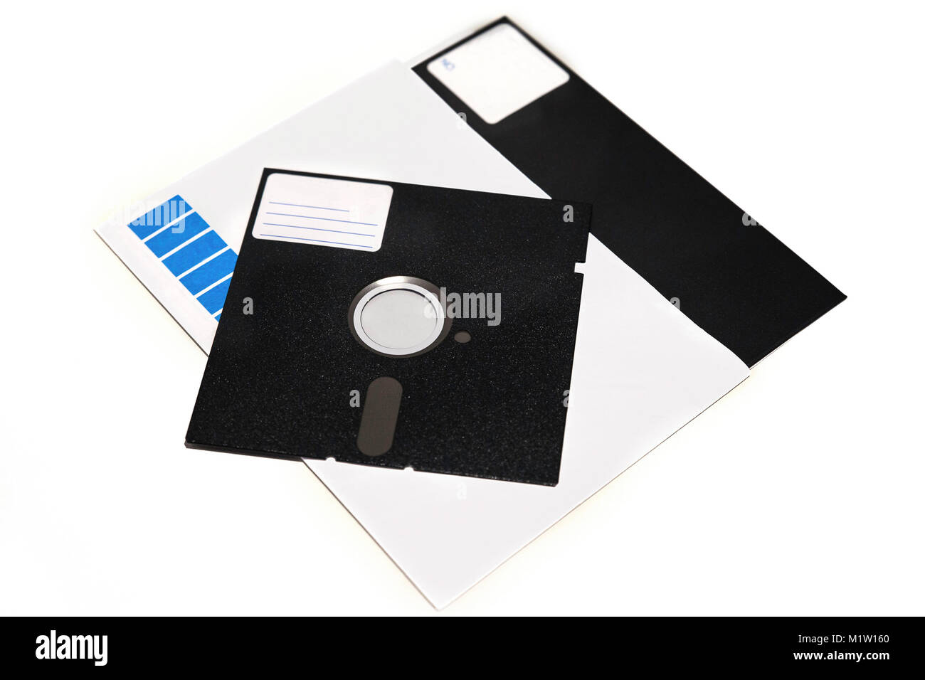 Old 5.25 and 8 inch floppy disks with label isolated on white background Stock Photo