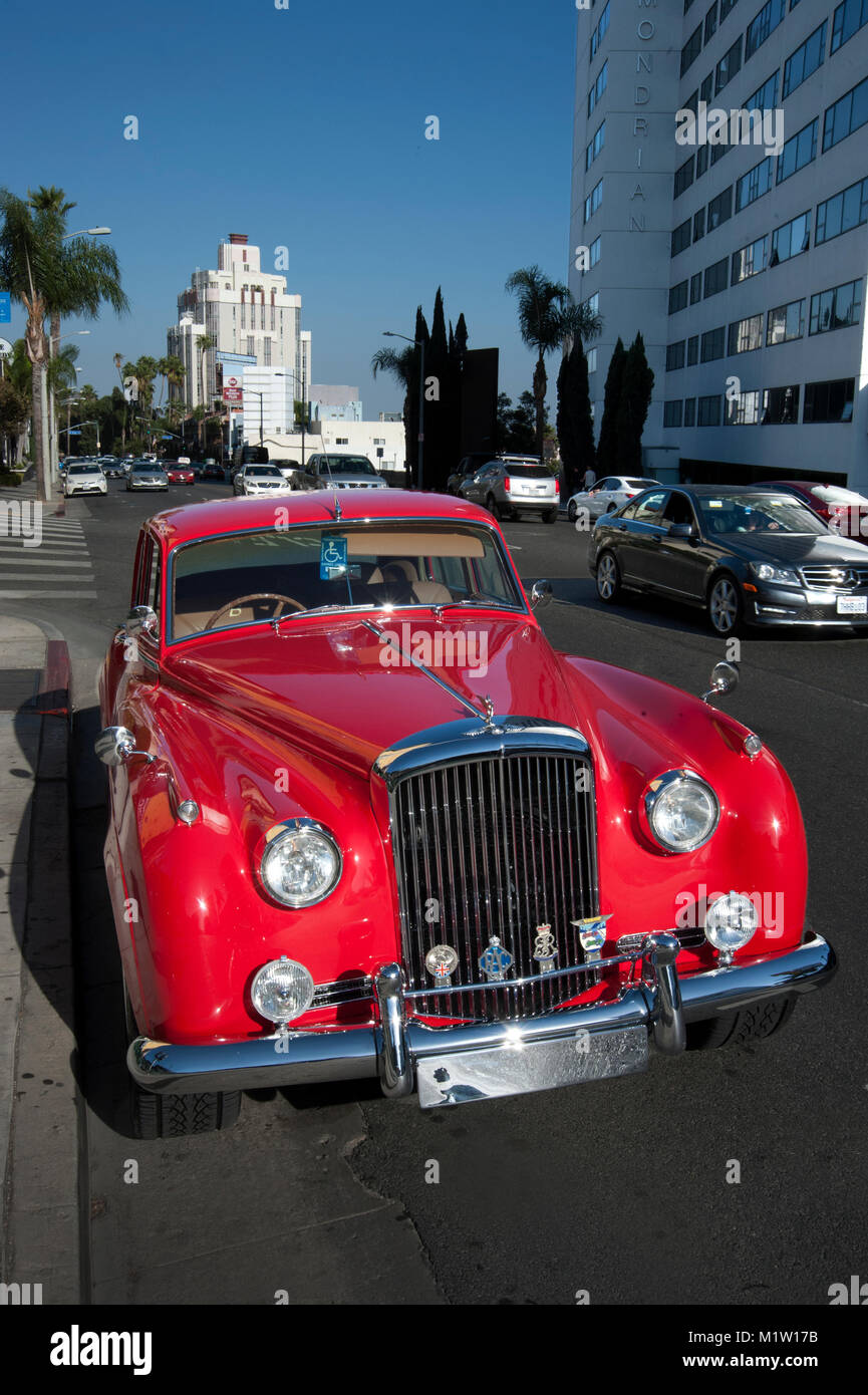 Red Rolls Royce automobile parked on the Sunset Strip in Los Angeles, CA Stock Photo