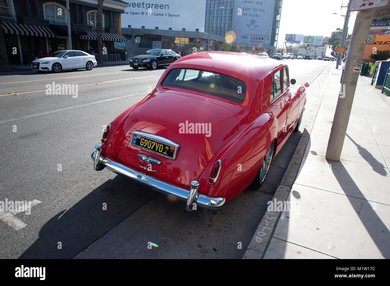 Red Rolls Royce automobile parked on the Sunset Strip in Los Angeles, CA Stock Photo