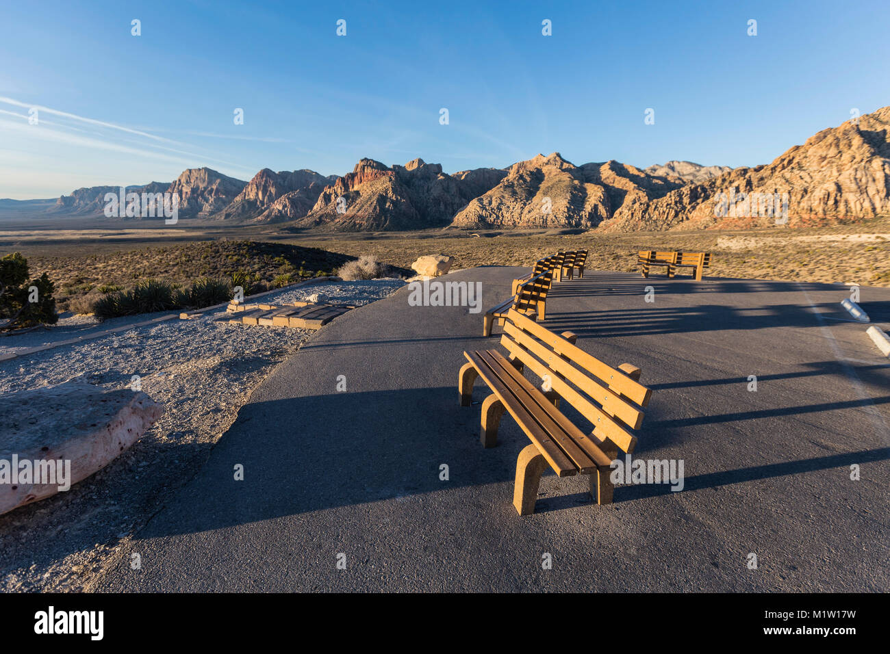 Welcoming benches in early morning light at Red Rock Canyon National Conservation Area scenic drive overlook near Las Vegas, Nevada. Stock Photo