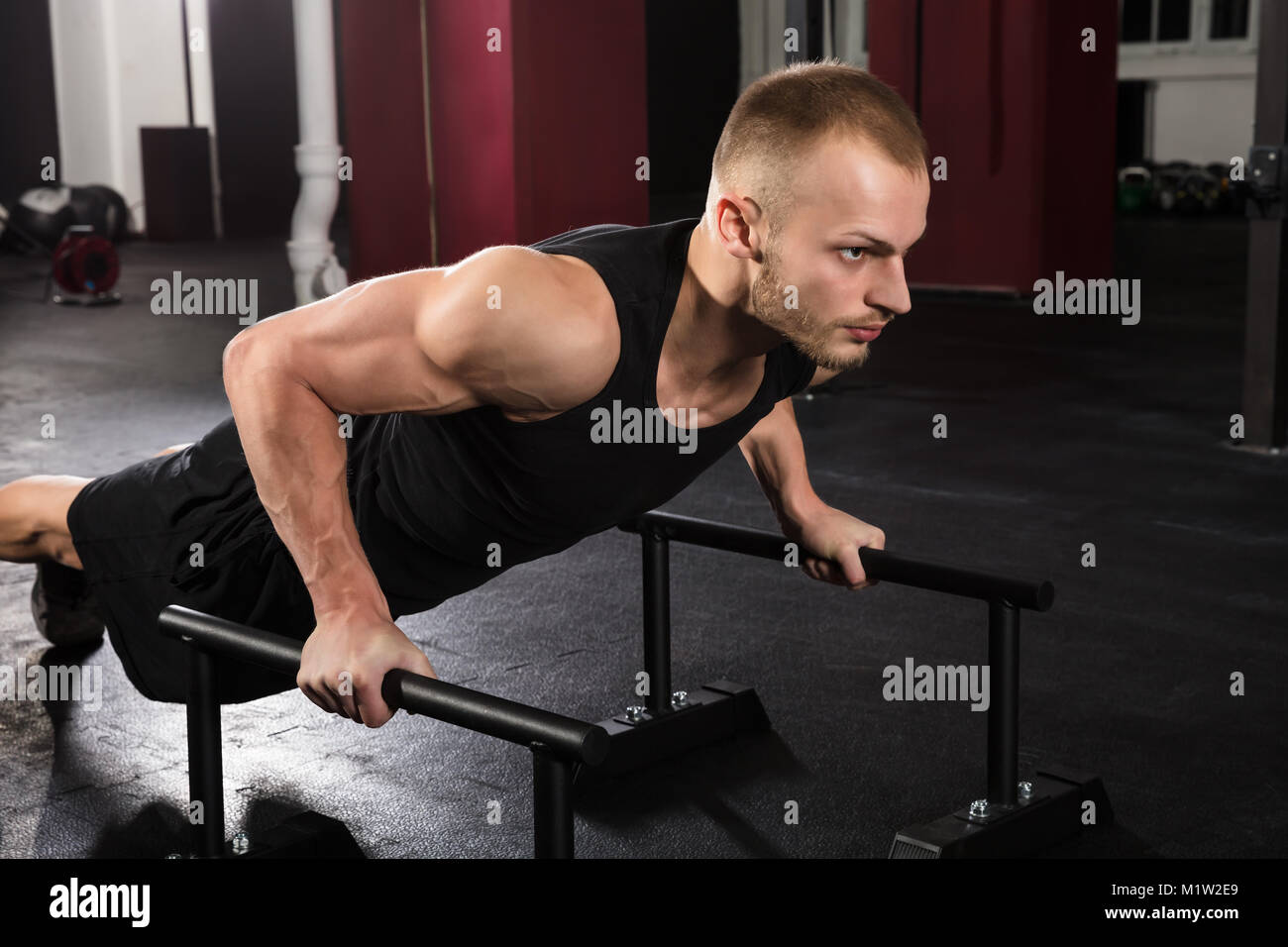 Young Athlete Man Doing Push-up Exercise In The Gym Stock Photo - Alamy