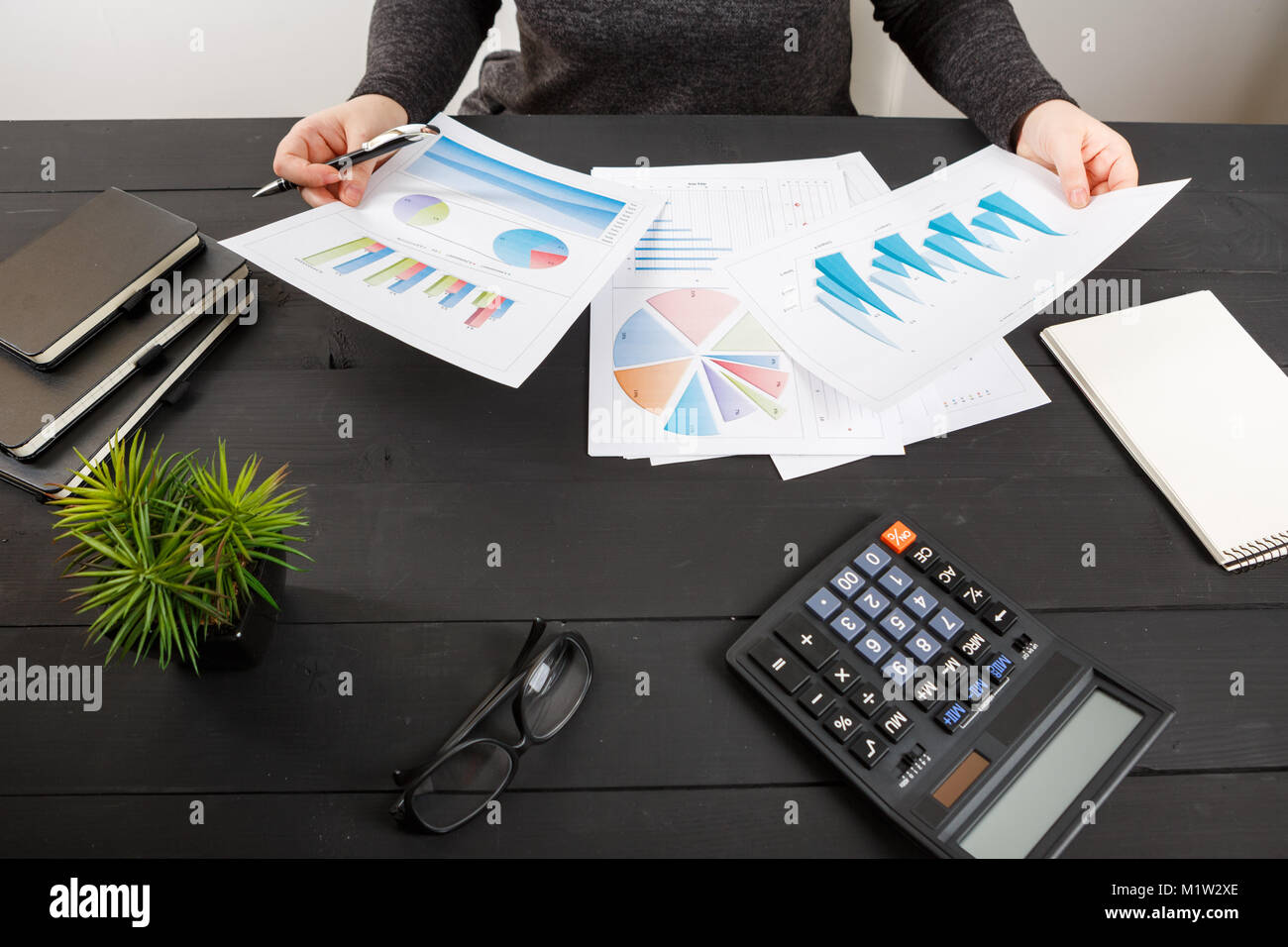 Close up of female accountant or banker making calculations. Savings ...