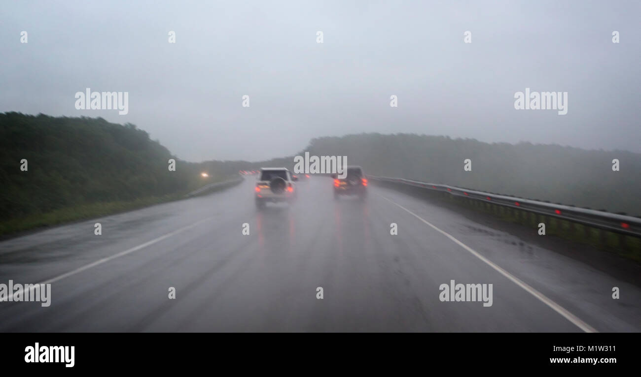 car in a country road with fog and low visibility Stock Photo - Alamy