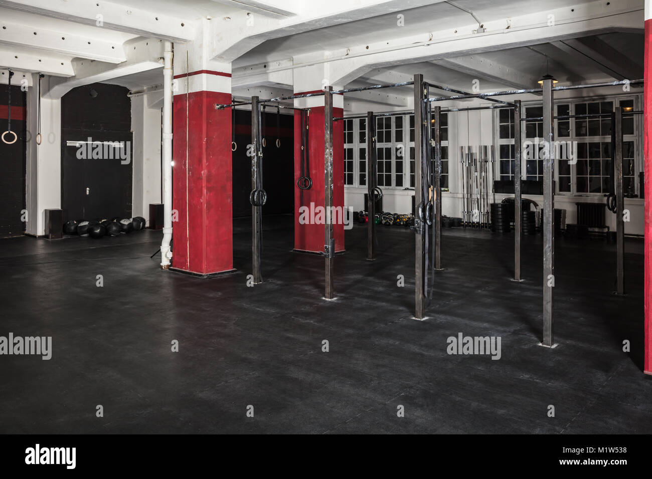An Interior Of An Empty Gym With Exercise Equipment Stock Photo