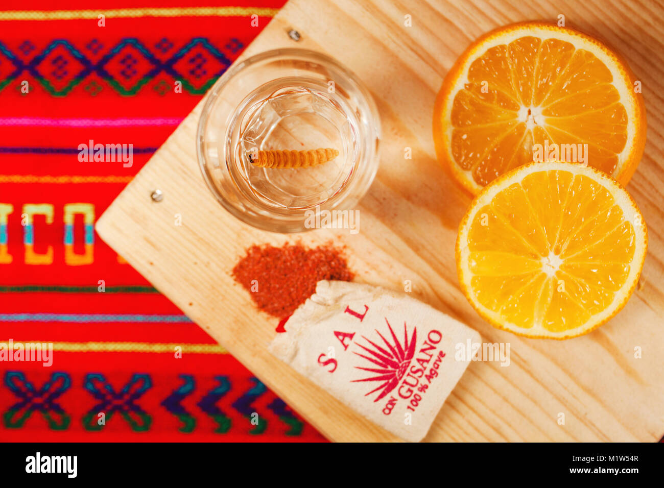 Mezcal mexican drink with orange slices and worm salt in oaxaca mexico