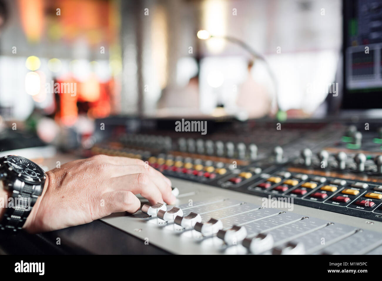 Mixer sound control concept. Hand control button sound mixer for music