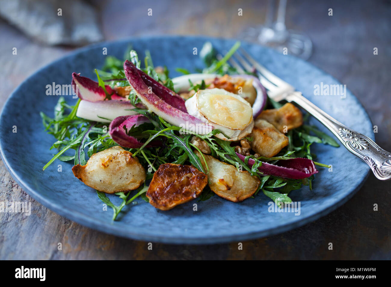 Jerusalem artichokes and grilled goat cheese salad with chicory and rocket Stock Photo Alamy