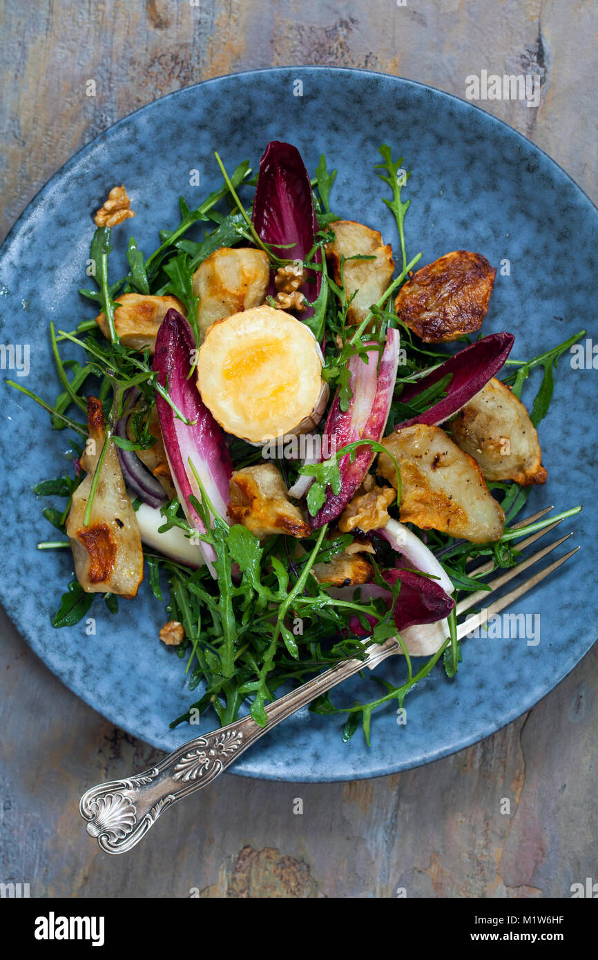 Jerusalem artichokes and grilled goat cheese salad with chicory and rocket Stock Photo Alamy