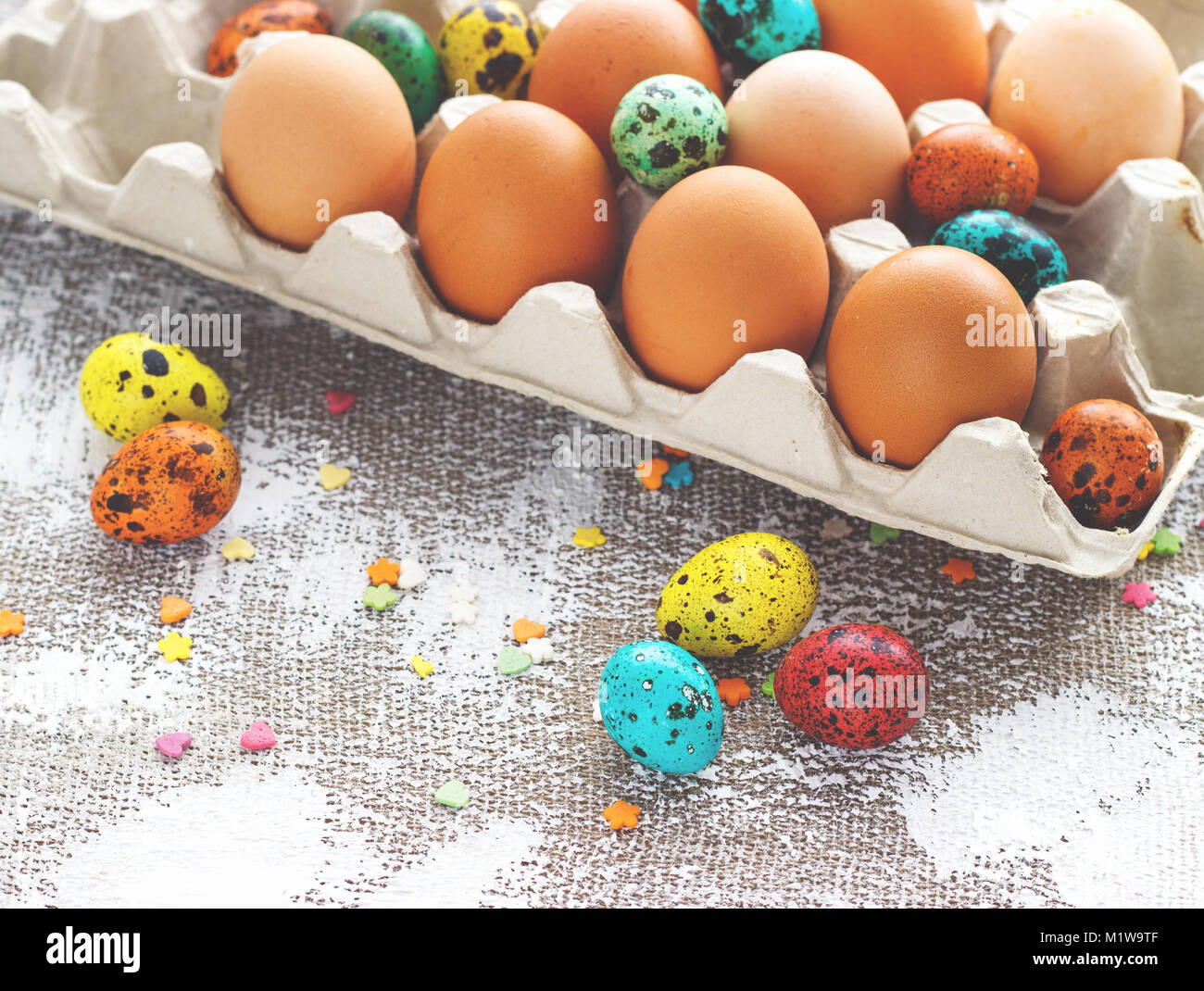 Colored easter eggs on a light canvas background,place for text. Stock Photo