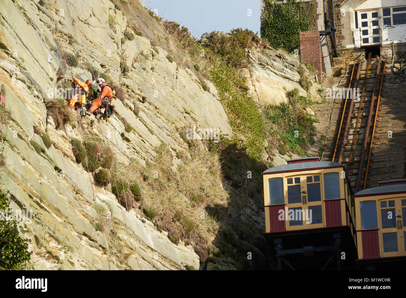 Hastings, specialist workmen stabilising East Hill cliff face, by the cliff lift, Rock-a-Nore, East Sussex, UK Stock Photo