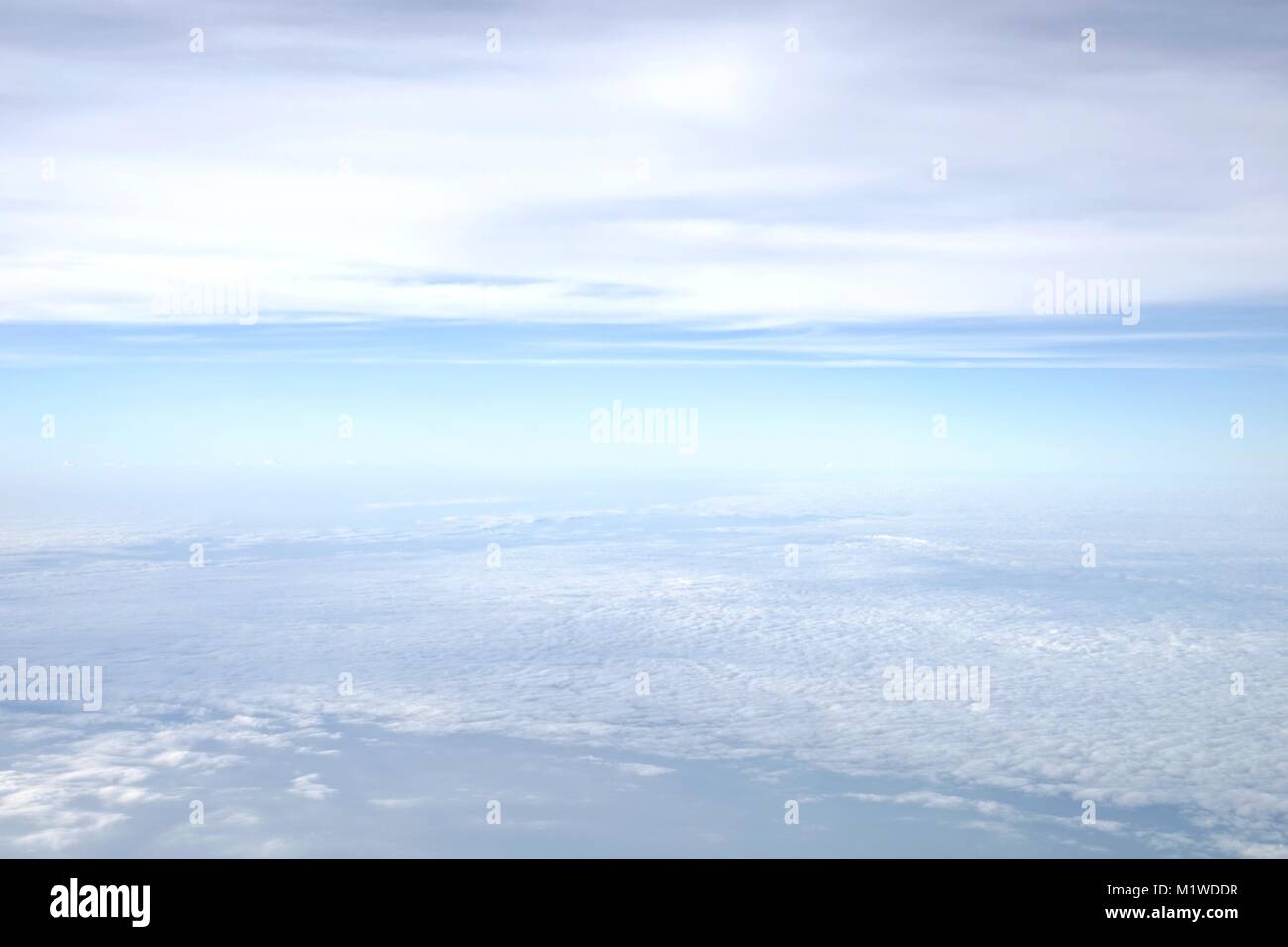 Aerial view of blue sky with soft fluffy white clouds. The view from ...