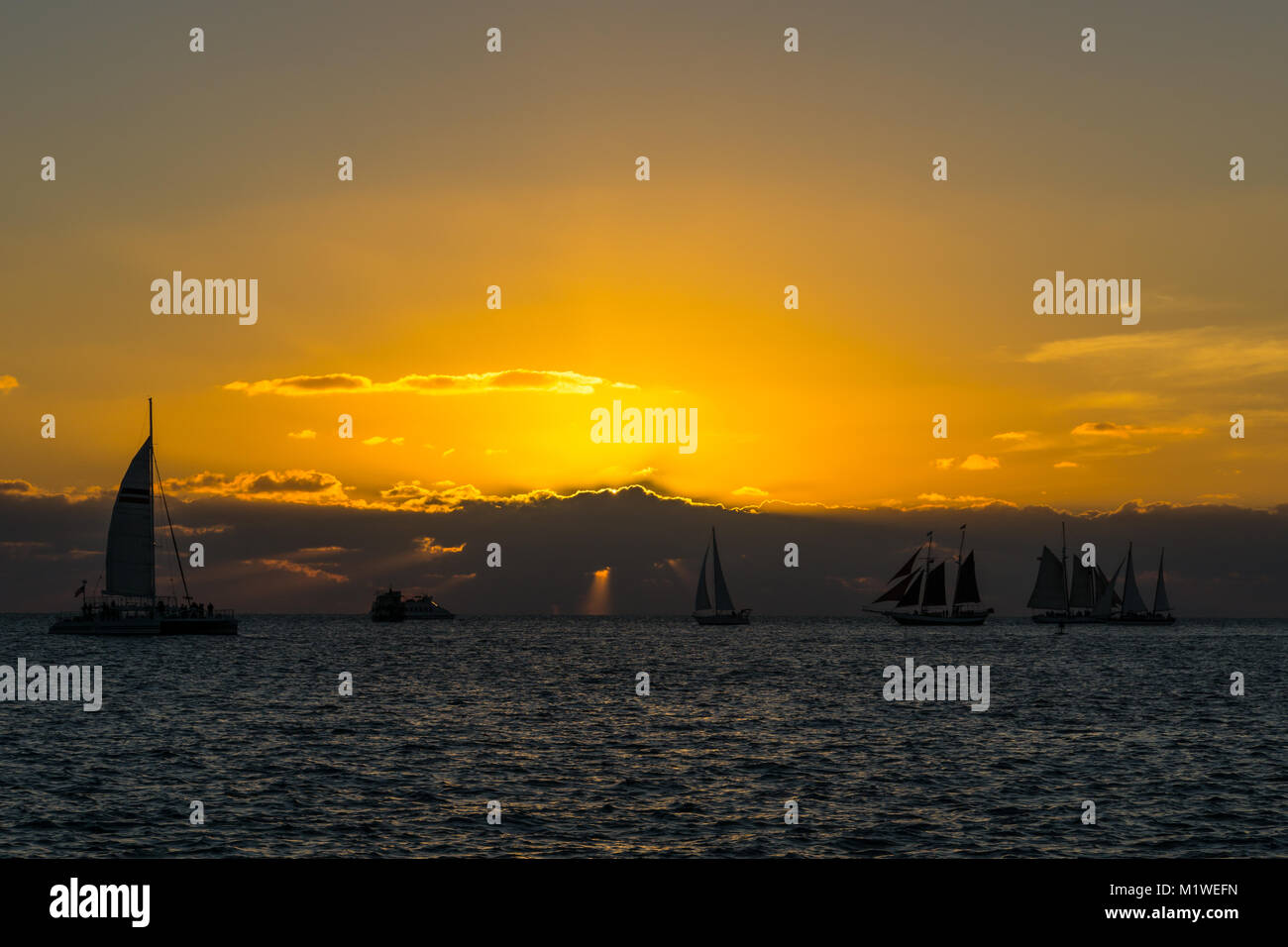USA, Florida, Beautiful huge sailing ships in romantic sunset atmosphere at key west Stock Photo