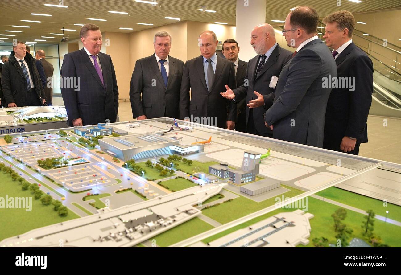Rostov-on-Don, Russia. 1st Feb, 2018. Russian President Vladimir Putin, center, views a scale model as he tours the Platov International Airport build for the 2018 FIFA World Cup February 1, 2018 in Rostov-on-Don, Russia. The region will host five matches during the tournament. Credit: Planetpix/Alamy Live News Stock Photo