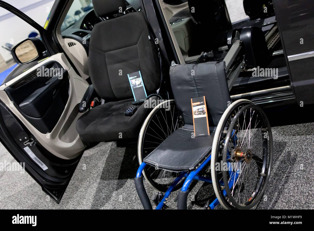 Wheelchair lift SPEEDY-LIFT (right) for minivans and Mazda 5, and XL-BASE  (left) to lift a person with an original seat, at the San Diego  International Auto Show, in December 2017. | usage
