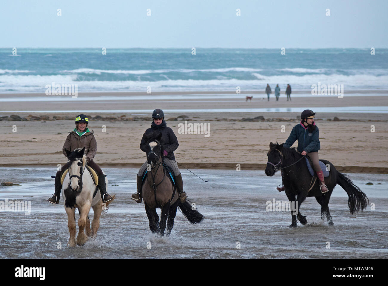 Perranporth beach, Cornwall, 2nd Feb 2018. UK Weather. A low tide and light winds made for ideal riding conditions on the beach at Perranporth in Cornwall. Credit: Kevin Britland/Alamy Live News Stock Photo