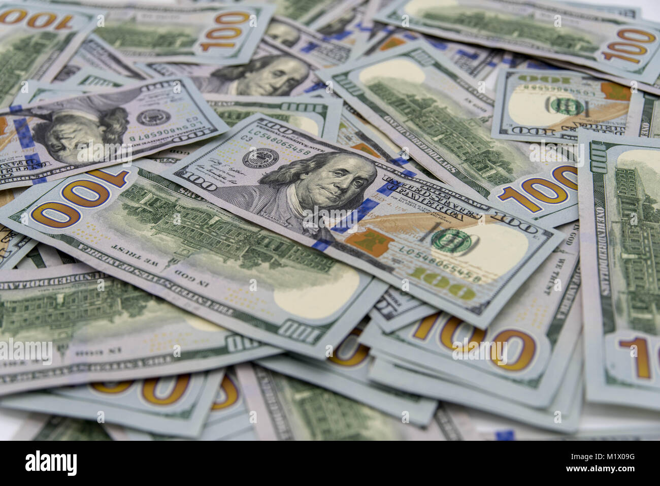 a stack of us 100 dollars cash with white background Stock Photo - Alamy