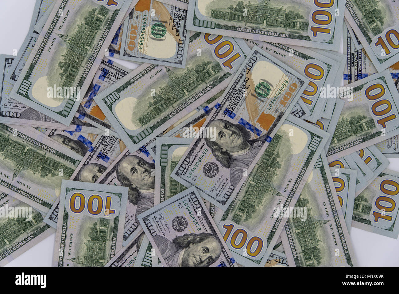 a stack of us 100 dollars cash with white background Stock Photo - Alamy