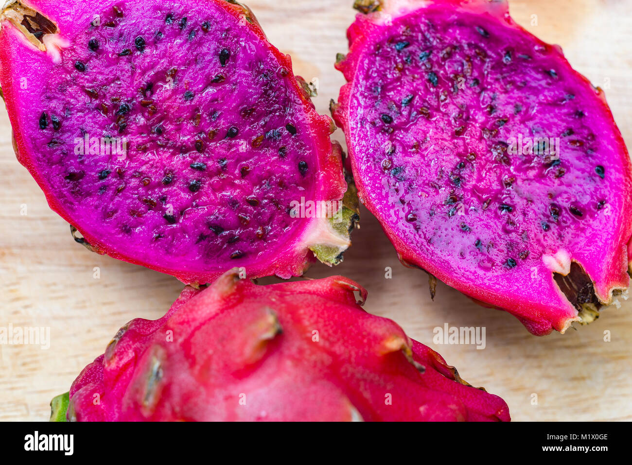 Pink dragonfruit cut macro photo. Pink dragonfruit cut macro photo on