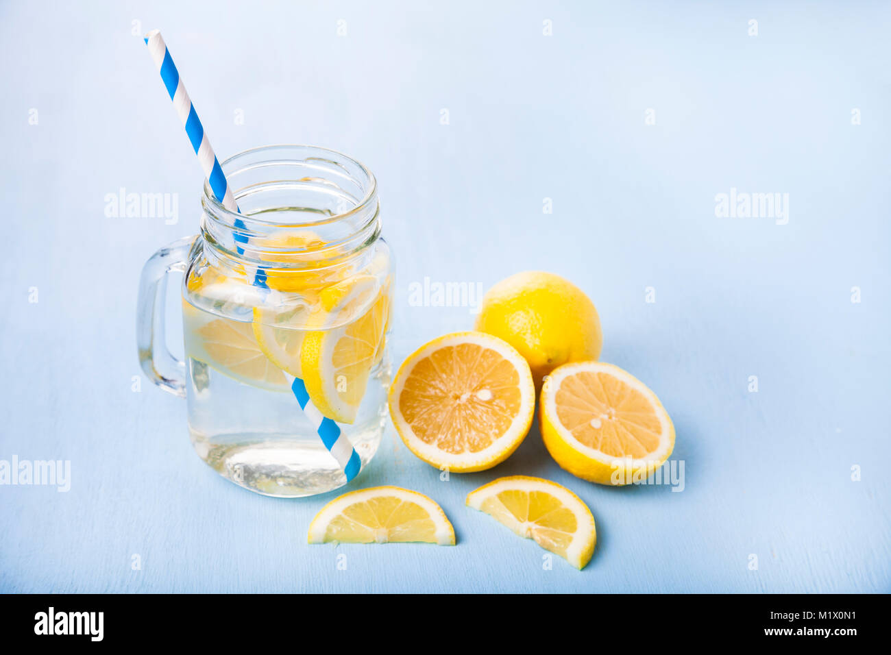 Refreshing ice cold water with lemon ready to drink. Concept of diet ...