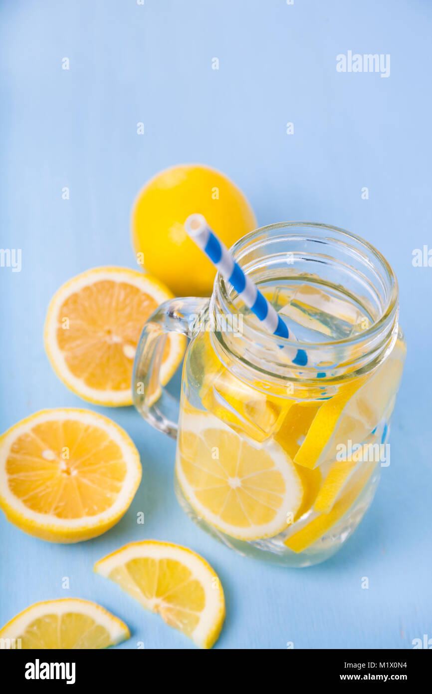 Refreshing ice cold water with lemon ready to drink. Concept of diet ...