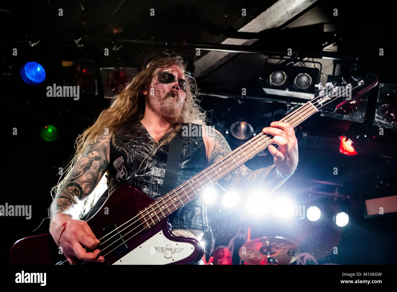 The Norwegian black metal band Svarttjern performs a heavy metal festival Blastfest 2016 in Bergen. Here bass player Malphas is seen live on stage. Norway, 17/02 2016. Stock Photo