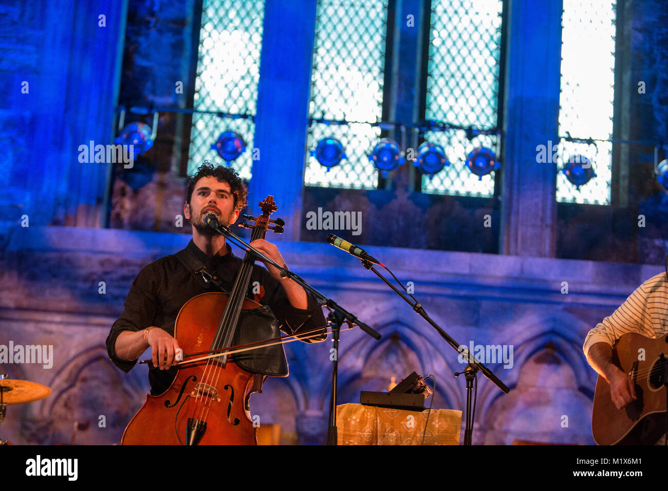 Norway, Bergen – June 14, 2017. The American progressive folk duo Tall Heights performs a live during the Norwegian music festival Bergenfest 2017 in Bergen. Here singer and cellist Paul Wright is seen live on stage. Stock Photo