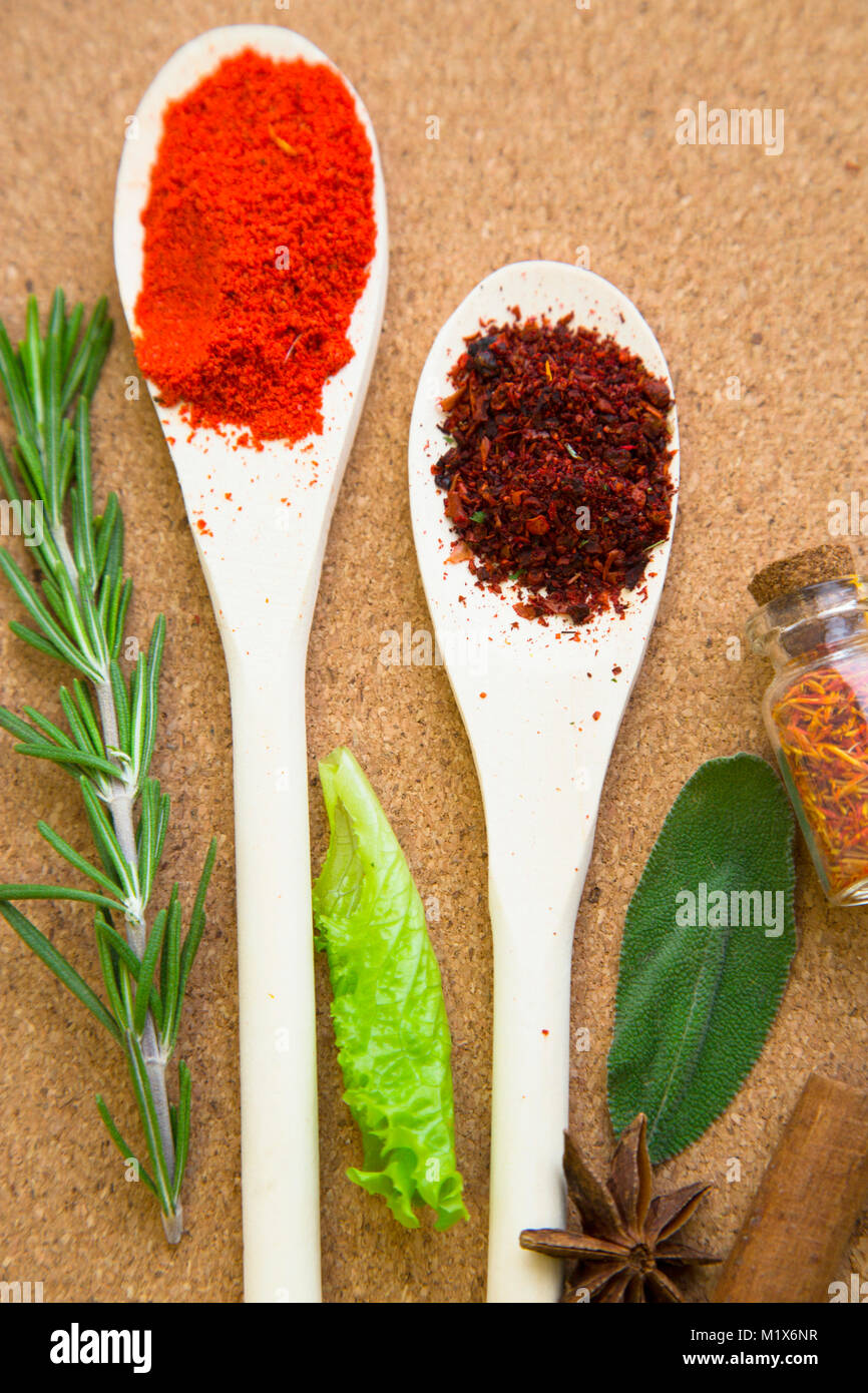 Set of spices and herbs on a corkwood Stock Photo Alamy