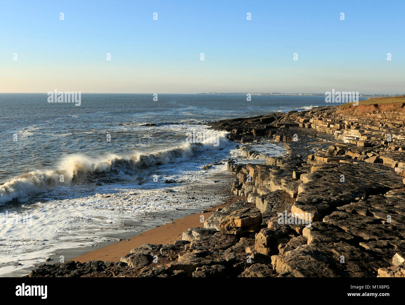 Ogmore By Sea showing limestone rock formations and high waves. Coastal view of welsh heritage coast. Stock Photo
