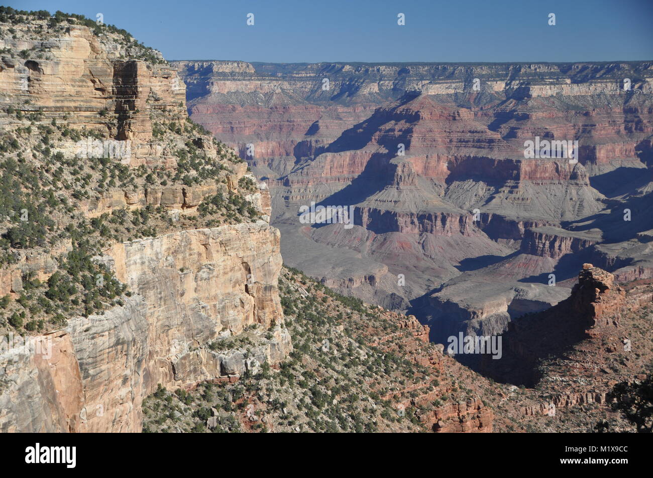 Coconino Sandstone cliff frames the Grand Canyon as seen from the Bright Angel Trail, Grand Canyon National Park, AZ, USA Stock Photo