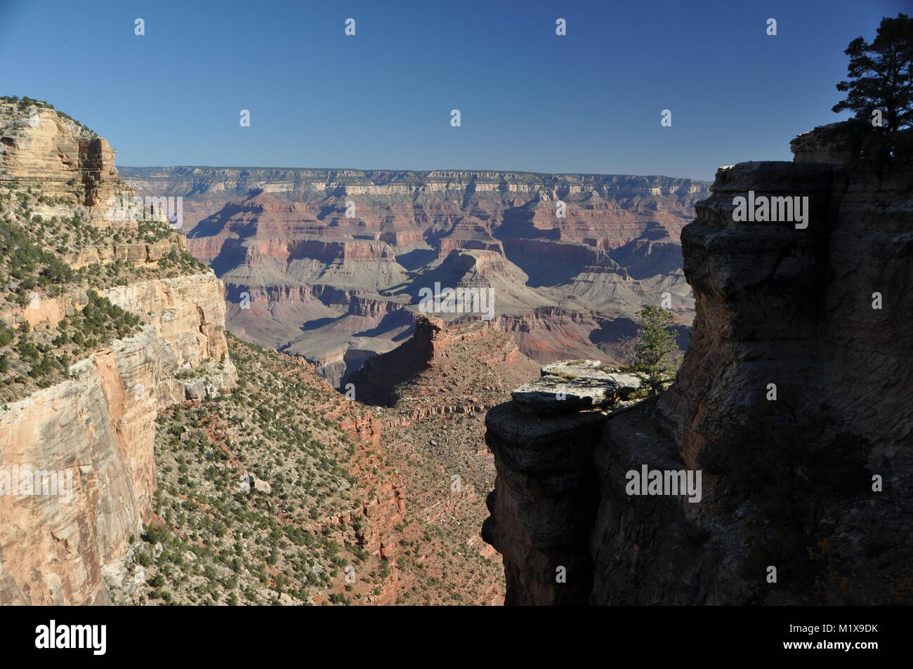 Coconino Sandstone cliff frames the Grand Canyon as seen from the Bright Angel Trail, Grand Canyon National Park, AZ, USA Stock Photo