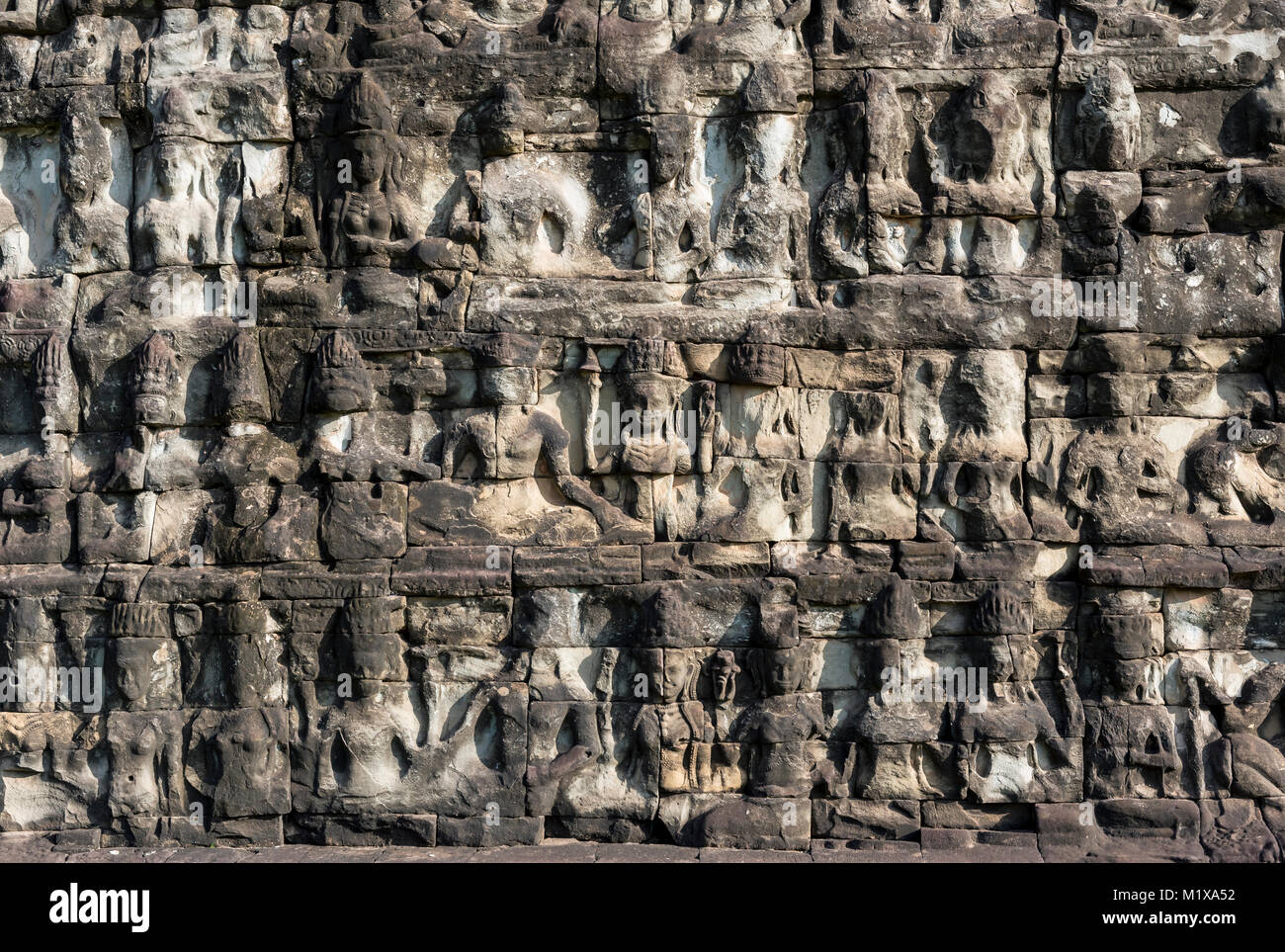 Carvings on the base of Terrace of the Leper King, Angkor Thom, Cambodia Stock Photo