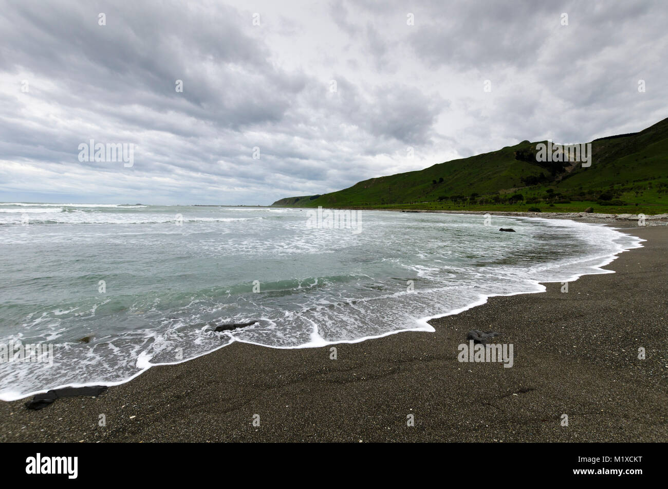 Storm clouds over beach, Glenburn, Wairarapa, New Zealand Stock Photo